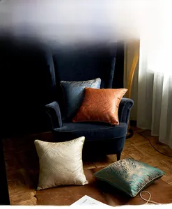 Detail of modern ripple jacquard pillow covers in blue and gold with high-density fabric