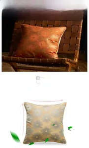 Close-up of decorative pillow cover with embossed floral pattern and gold piping detail