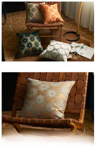Close-up of metallic jacquard pattern on velvet cushion covers with elegant floral texture