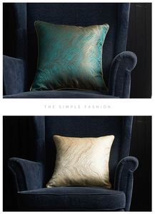 Detail of modern jacquard pillow cover with gold wavy patterns on satin fabric surface