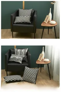 Detailed close-up of geometric black and white jacquard cushion covers on a sofa