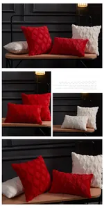 Detailed view of geometric diamond texture on red and beige plush pillow covers