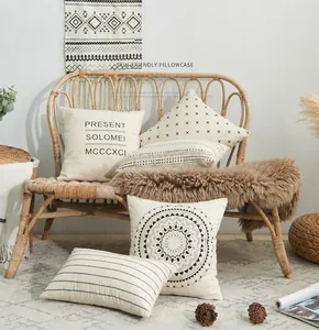 Detailed texture of cotton cushion covers with minimalist geometric and letter prints
