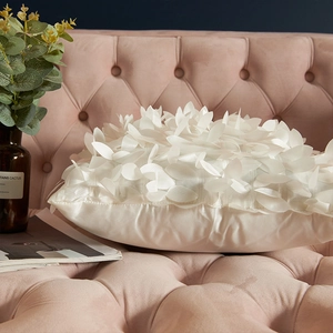 3D leaf petal decorative pillow cover in cream white satin on pink velvet sofa