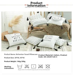 Detail of bohemian cotton canvas pillowcases with printed patterns and black tassels
