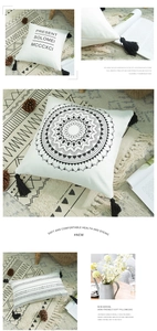 Close-up of bohemian cotton canvas pillowcase with mandala print and black corner tassels