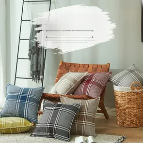 Close-up of thick linen plaid pillow covers with detailed British weave texture in a home setting
