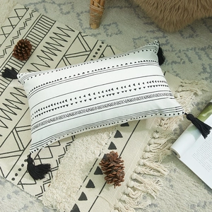Bohemian cotton canvas lumbar pillow cover with black geometric prints and corner tassels