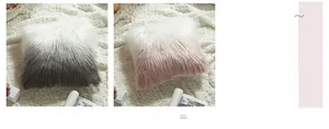 Detail of plush gradient faux fur cushion cover in grey and pink with soft texture