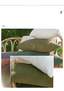 Detailed view of chenille cushion covers with textured grid pattern in various colors
