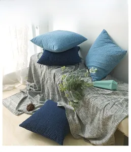 Detail of Nordic denim blue cushion cover texture and woven fabric on a cozy sofa