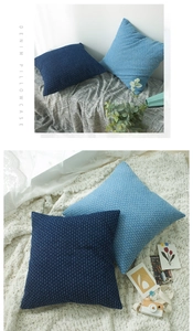 Close-up of denim blue decorative pillowcases with premium textured woven fabric details