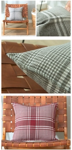 Close-up of thick woven linen plaid cushion covers in grey and burgundy colors