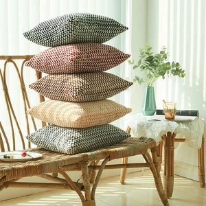 Stack of five herringbone textured throw pillow covers in assorted warm autumn colors