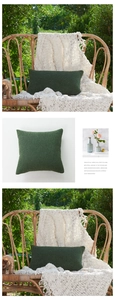 Detailed texture of forest green chenille pillow cover on a wicker chair outdoors