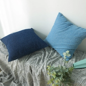 Blue Nordic denim waffle textured decorative pillow covers in light and deep navy blue
