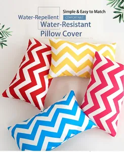 Close-up of waterproof wavy stripe cushion covers in vibrant red, yellow, pink, and blue