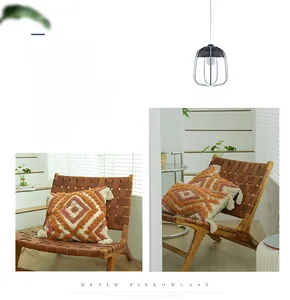 Close-up of bohemian tufted geometric diamond pattern pillowcase with corner tassels