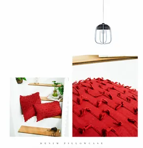 Detail of red textured tufted pillowcase with decorative 3D tassel and wave patterns