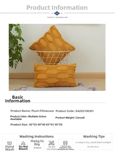 Close-up of mustard yellow plush cushion cover with 3D geometric embroidered chain texture