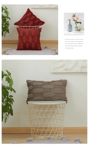 Close-up of geometric plush cushion cover featuring 3D hexagonal tufted embroidery textures