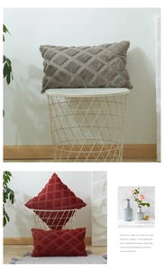 Detail of plush geometric diamond quilted pattern on velvet throw pillow cover