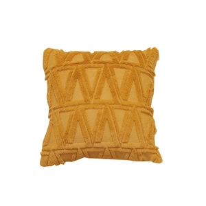 Nordic mustard yellow tufted cushion cover with geometric triangle pattern on white background