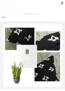 Close-up of invisible zipper and tufted star embroidery on black cotton pillow cover