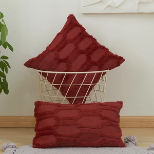 Set of two red plush cushion covers with geometric hexagonal pattern for sofa decor