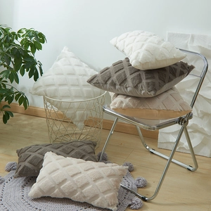 Plush throw pillow covers with 3D geometric diamond patterns in neutral earth tones