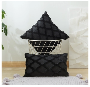 Detail of black geometric textured throw pillow covers in square and lumbar styles