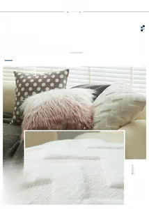 Detail of plush gradient faux fur and geometric 3D texture on luxury sofa pillows