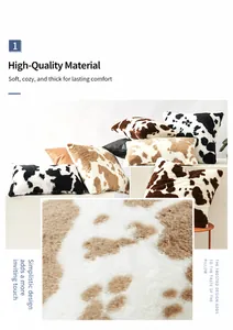 Nahaufnahme der flauschigen Kissenbezüge mit Kuhmuster und orangefarbenem Kunstleder