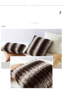 Detail of plush striped throw pillow cover with soft faux fur texture in coffee and cream