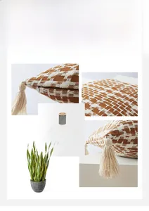 Detail view of woven brown checkerboard pillowcase with cotton tassels and hidden zipper