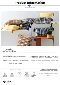 Detail of woven checkerboard cushion cover with fringe trim and polyester-cotton texture