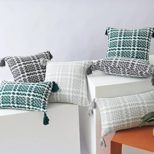 Nordic woven throw pillow cases with decorative tassels and geometric textured patterns