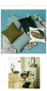 Detail of Nordic cushion covers with houndstooth pattern and green leaf embroidery