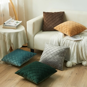 Dutch velvet quilted diamond pattern pillow covers in assorted colors on a white sofa