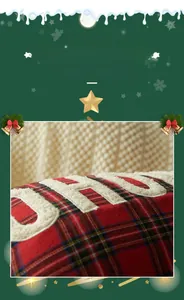Close-up of red plaid Christmas pillow cover featuring plush HO HO embroidery detail