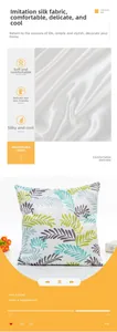 Detailed view of imitation silk pillowcase featuring smooth fabric and green leaf patterns