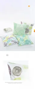 Detail of satin jacquard pillowcase showing green leaf patterns and fabric texture