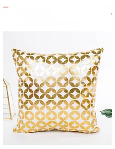 Detail of white square cushion cover with minimalist gold foil geometric patterns