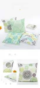 Detailed view of satin jacquard pillowcase with green leaf motifs and hidden zipper