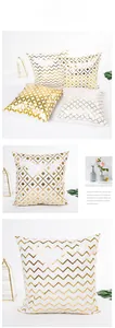 Detail of four-piece white pillow covers featuring geometric gold foil stamped patterns