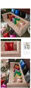 Showcase of square sequin pillow covers in various colors on an elegant velvet sofa