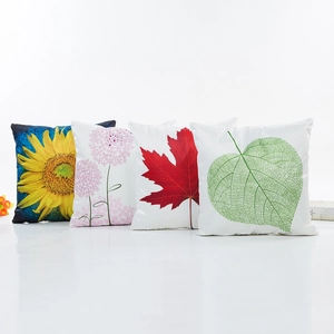 Satin decorative pillow covers with vibrant floral and leaf prints in a set of four