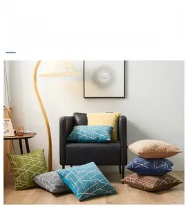 Detailed view of chenille pillow covers featuring modern geometric lines in various colors