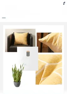 Macro detail of yellow chenille pillow cover featuring white geometric lines and stitching