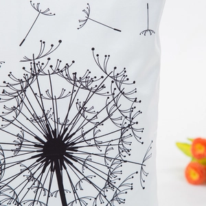 Nordic style faux silk pillowcase with black dandelion print on white fabric surface